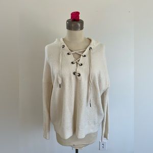 Alice+Olivia white sweater with crisscross front. Size large.